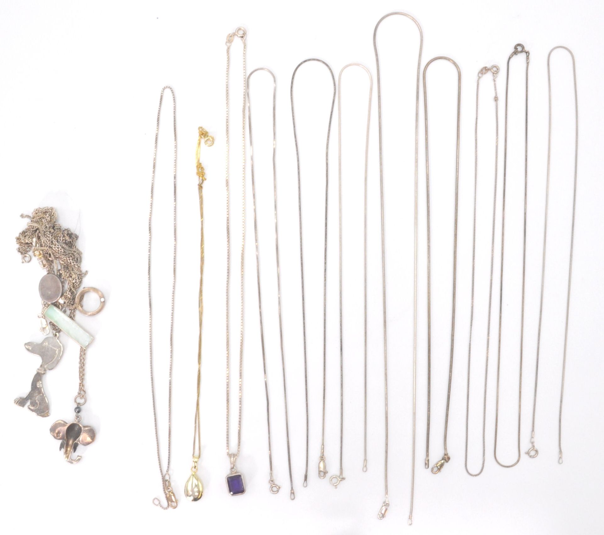 A collection of silver necklace chains, mostly fine linked with clasps. To also include a gilded
