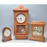 A group of three vintage 20th Century clocks to include an oak cased mantel clock having a