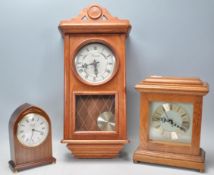 A group of three vintage 20th Century clocks to include an oak cased mantel clock having a