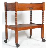 A vintage 1930's drinks / office trolley having two rectangular tiers raised on Barley twist and