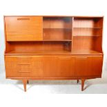 A retro mid 20th Century teak wood sideboard / highboard having a drop down cocktail cabinet to