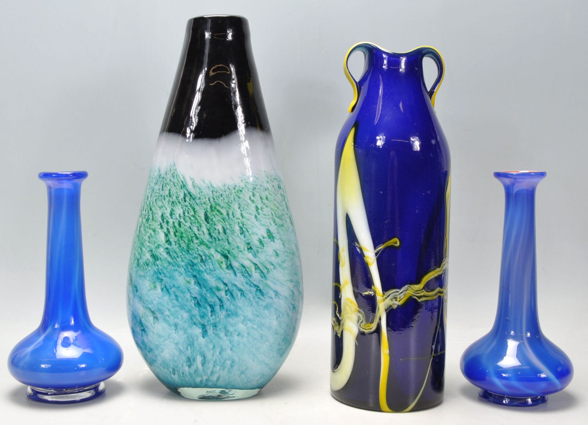 A selection of vintage retro studio art glass to include a blue and yellow cased glass vase with