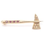 A 9ct gold bar brooch in the form of an axe inset with diamonds and garnets, pin verso. Total weight