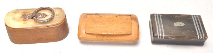 A good antique olive wood snuff box having a horn cover top and hoop handle. Together with a