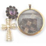 An antique pearl crucifix together with a mourning locket with platted hair encased in yellow