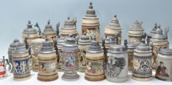 A collection of 20th Century German ceramic stein drinking glasses, each having raised decoration to