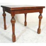 A 1930's Art Deco oak refectory draw leaf dining t