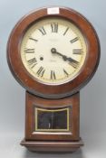 A contemporary Victoria President 31 day mahogany cased wall clock set in shaped case with glass