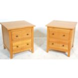 A modern contemporary pair of hardwood DFS bedside chests of drawers  / tables. Each raised on
