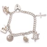 A contemporary hallmarked sterling silver charm bracelet with charms in the shape of a heart
