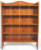 A 19th century Victorian golden oak Arts & Crafts open window bookcase. Raised on arched supports