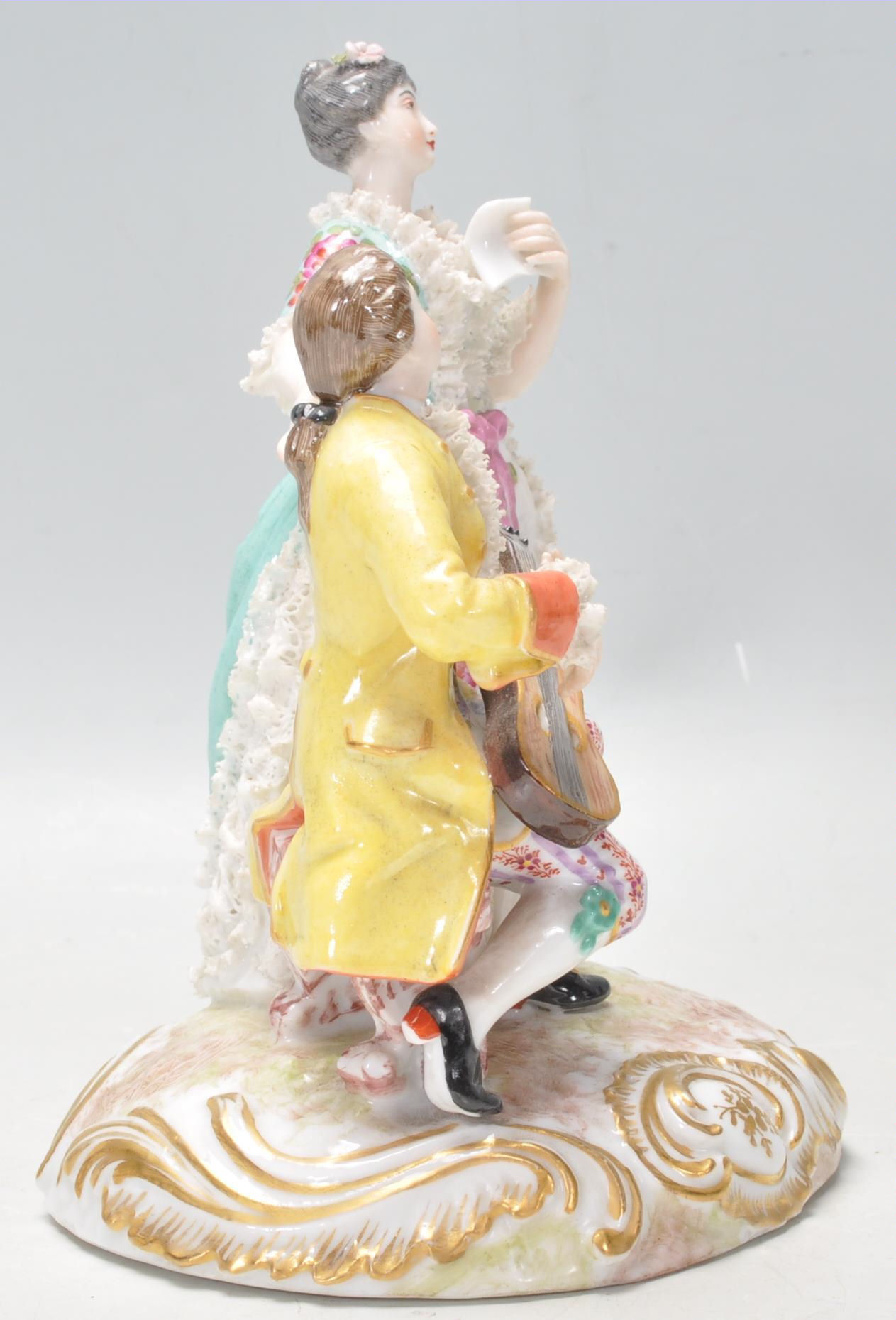 A 20th Century German Meissen / Dresden group figurine in the form of a couple with a seated man - Image 3 of 13