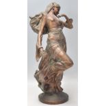 A 20th century antique style bronze effect resin she elf  / nypmh figure signed to the base