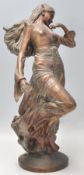 A 20th century antique style bronze effect resin she elf  / nypmh figure signed to the base
