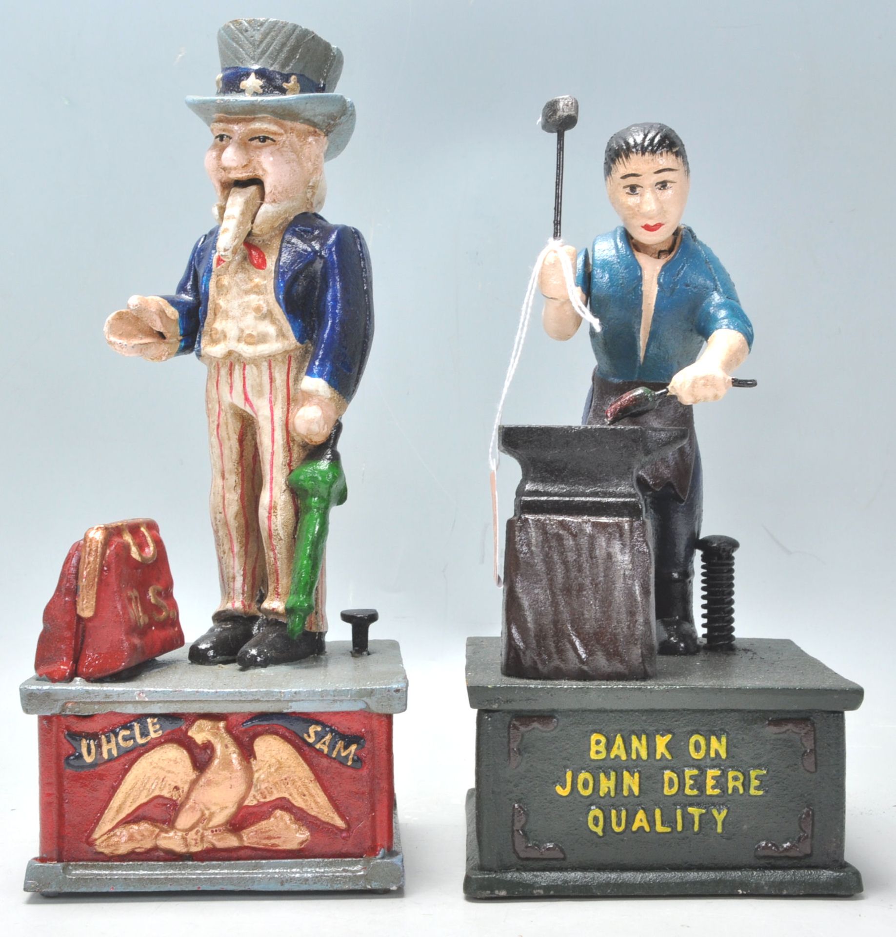 Two 20th Century vintage style cast iron money banks in the form of Uncle Sam and John Deere. Both