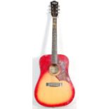 A good quality Hustler made six string acoustic guitar having a sunburst body with floral