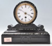 A late 19th Century black marble barrel mantel clock having a plinth base with round clock mounted