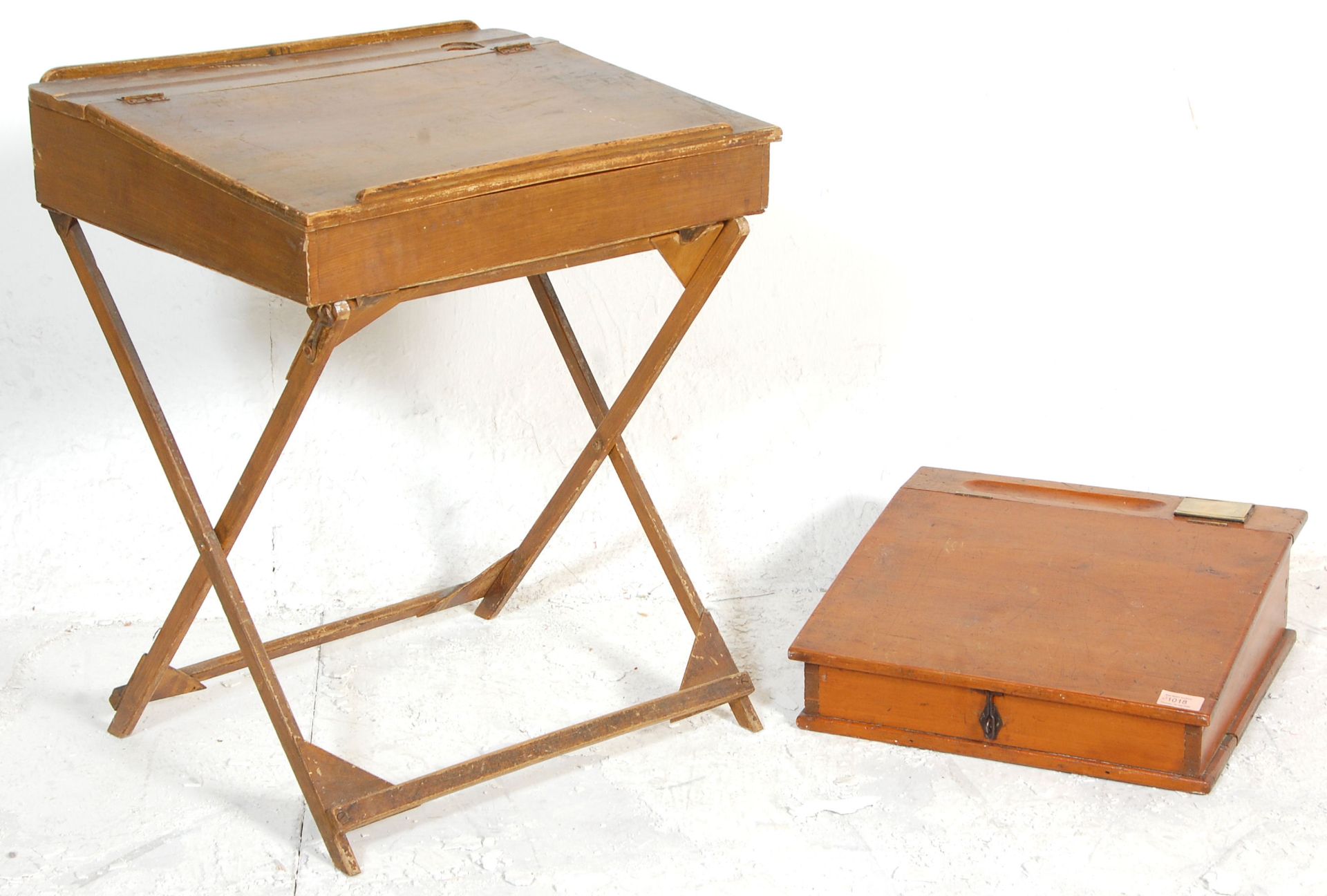 Two vintage early 20th Century oak slopping school / accountants desks with one having a pen rest