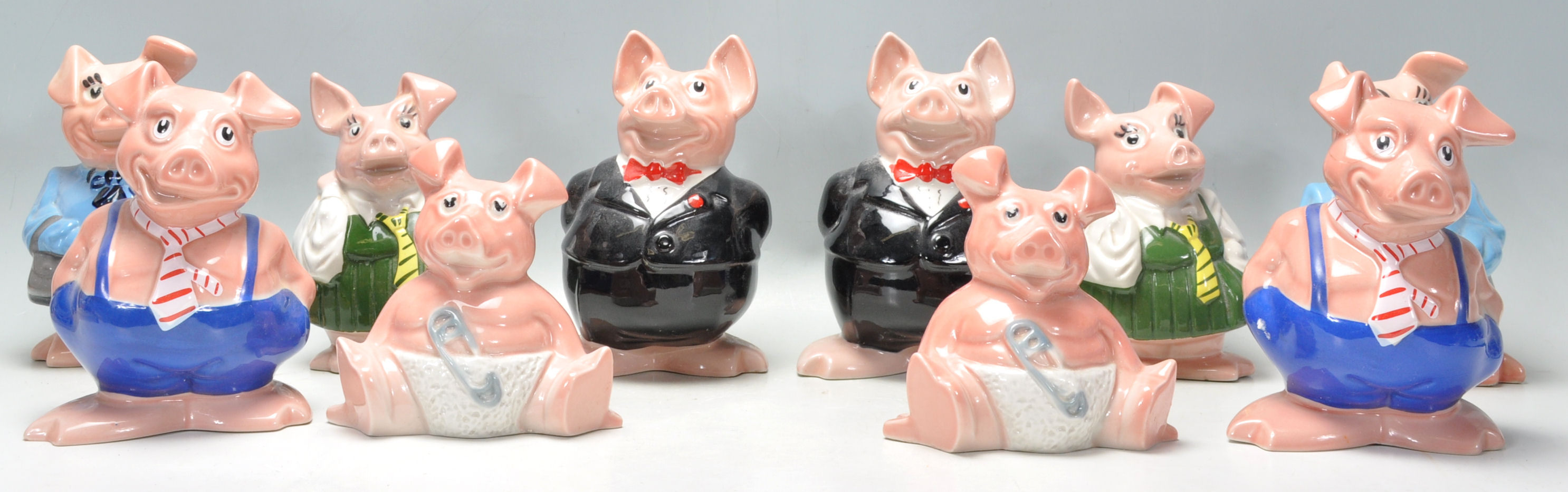 A collection / set of 20th century Wade Nat West Pigs ( see illustrations ). Measurements: 18 cm