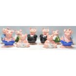 A collection / set of 20th century Wade Nat West Pigs ( see illustrations ). Measurements: 18 cm