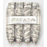 A silver vesta case in the form of four cuban cigars and the word Havana stamped on both sides.