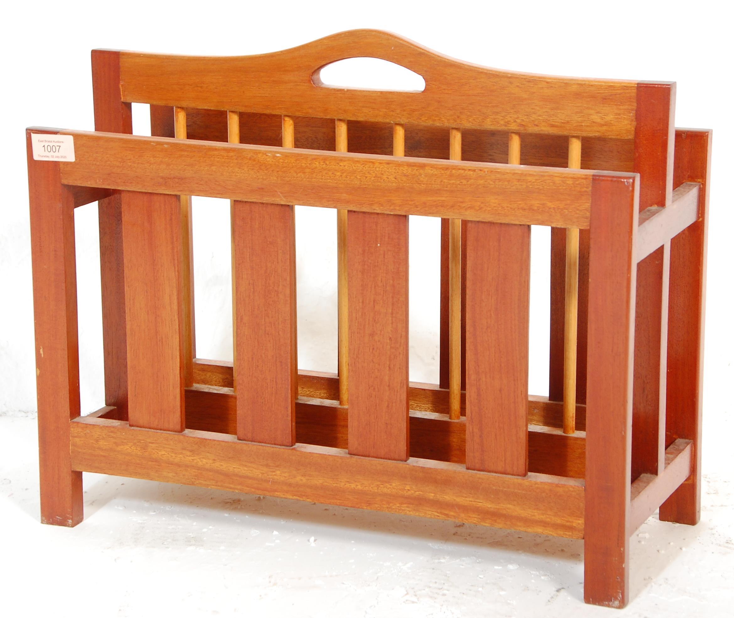 A retro 20th Century Danish teak wood retro magazine rack - canterbury. The panelled body with