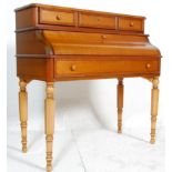 A contemporary French fruitwood bonheur de jour - secretaire / bureau desk. The bureau having a