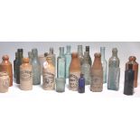 A good large collection of glass and stoneware advertising bottles with many local examples to