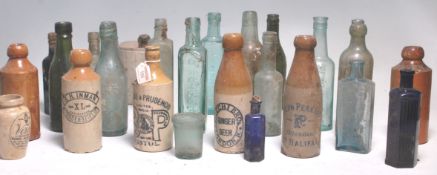 A good large collection of glass and stoneware advertising bottles with many local examples to