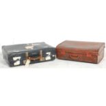 Two vintage retro mid 20th Century leather cased travelling suitcases / trunks to include a faux