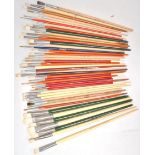 A good collection of vintage branded hog bristle paint brushes of various sizes and shapes, brands