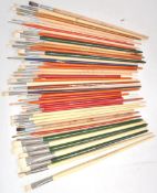 A good collection of vintage branded hog bristle paint brushes of various sizes and shapes, brands