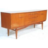 A vintage retro 20th Century teak wood sideboard - credenza of Danish design. The sideboard having a