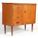 A mid century retro, circa 1970's teak wood sewing table cabinet – desk combination having fold