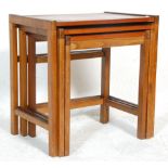 A good retro mid 20th Century Danish inspired teak wood nest of tables of square form. Raised on