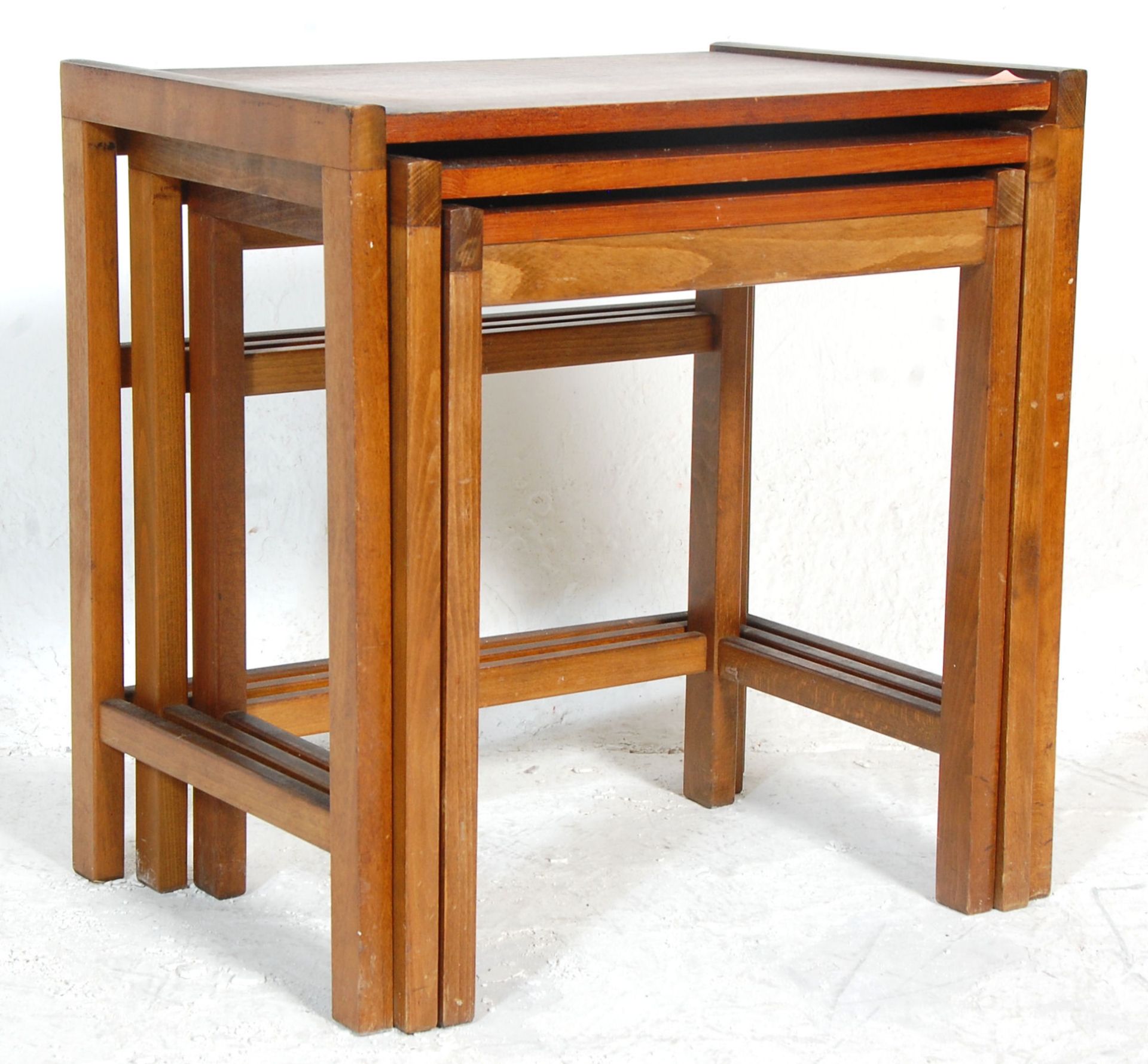 A good retro mid 20th Century Danish inspired teak wood nest of tables of square form. Raised on