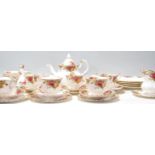 A Royal Albert bone china tea service in the Old Country Roses pattern to include a teapot, dinner