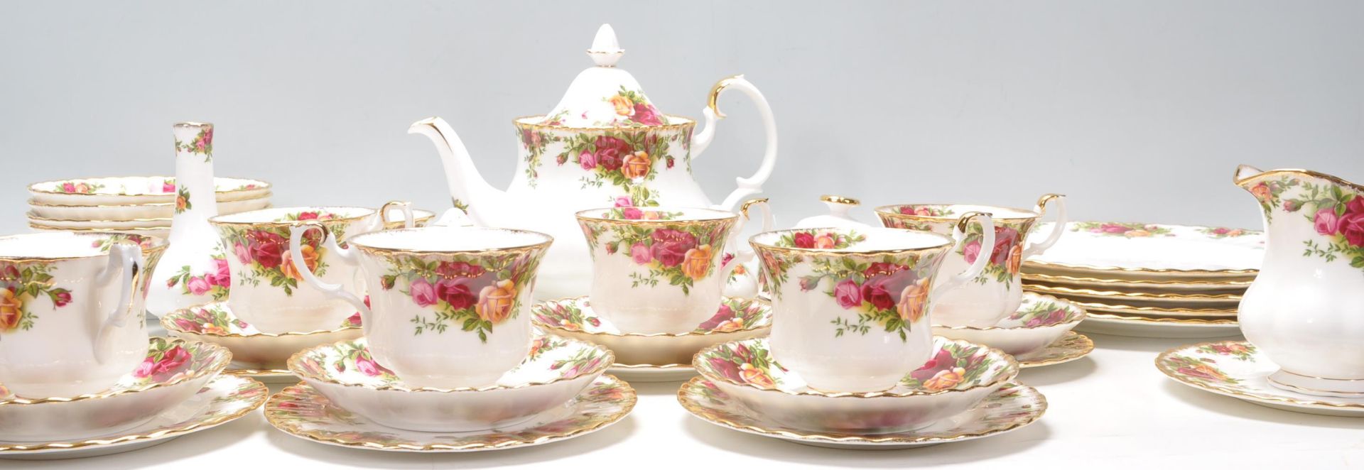 A Royal Albert bone china tea service in the Old Country Roses pattern to include a teapot, dinner