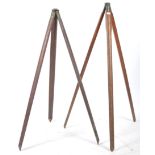 An early 20th century wooden and cast metal surveyors tripod stand.The tapering wooden  legs