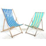 A pair of vintage retro wooden framed folding deck chairs together with a set of three vintage