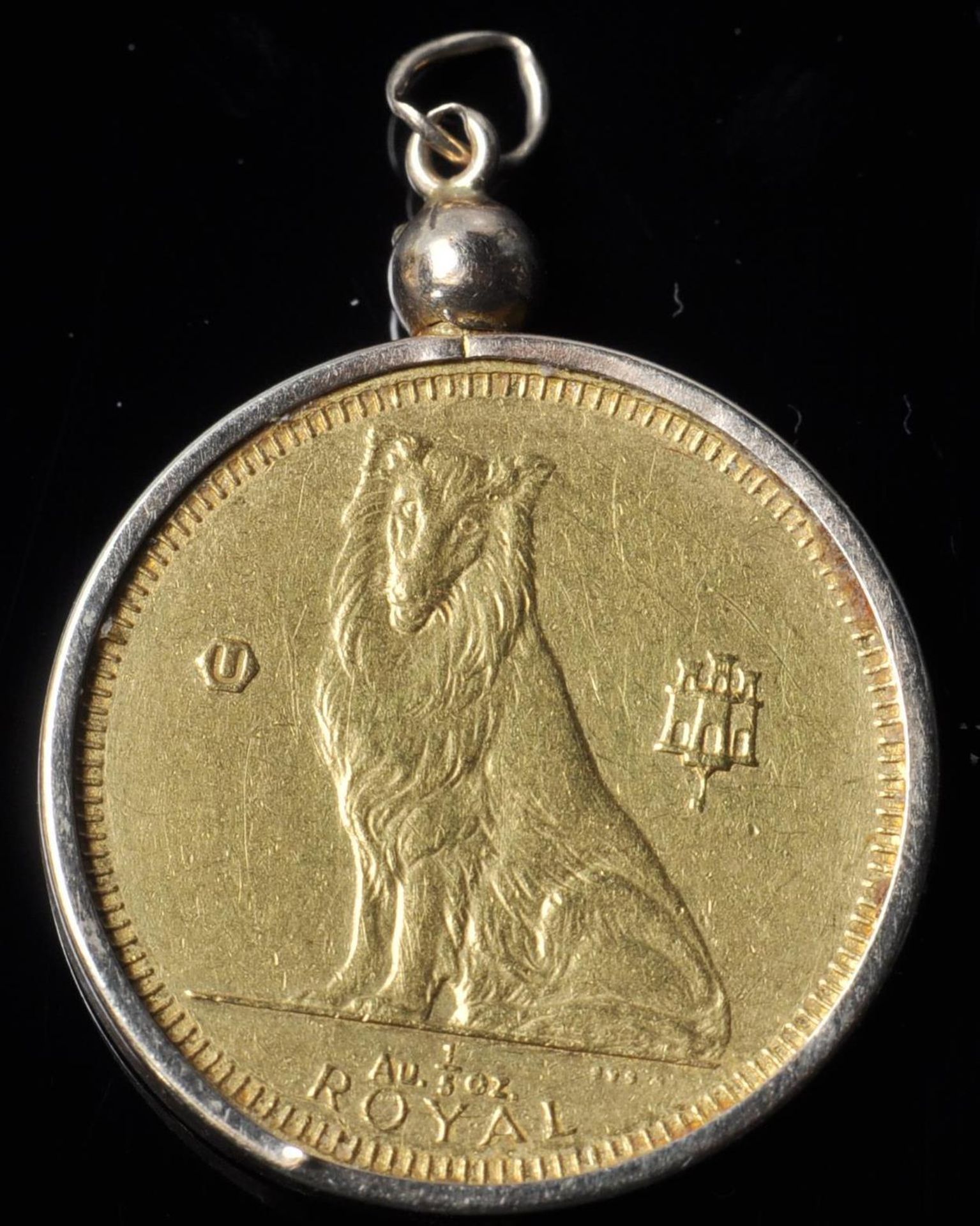A 1995 Gibralter Collie dog 999 fine gold coin set within a 14ct gold coin mount. Coin marked 999