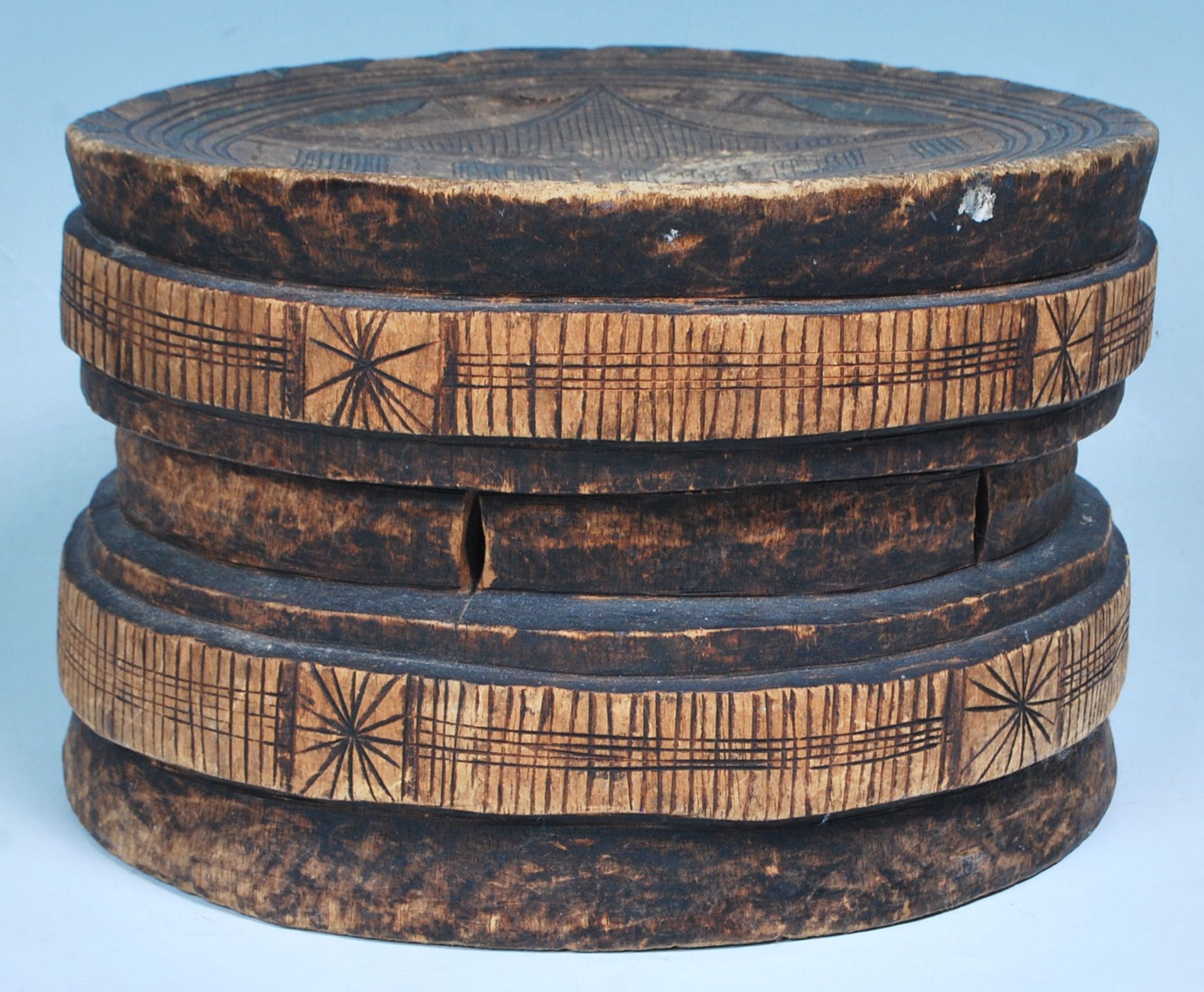 An African tribal Lega low circular stool from the Democratic Republic of the Congo having an