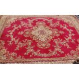 An early 20th Century Persian / Islamic floor rug having red and cream ground with a central
