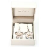 A pair of Kit Heath original modernist sterling silver earrings. The earrings with flower head