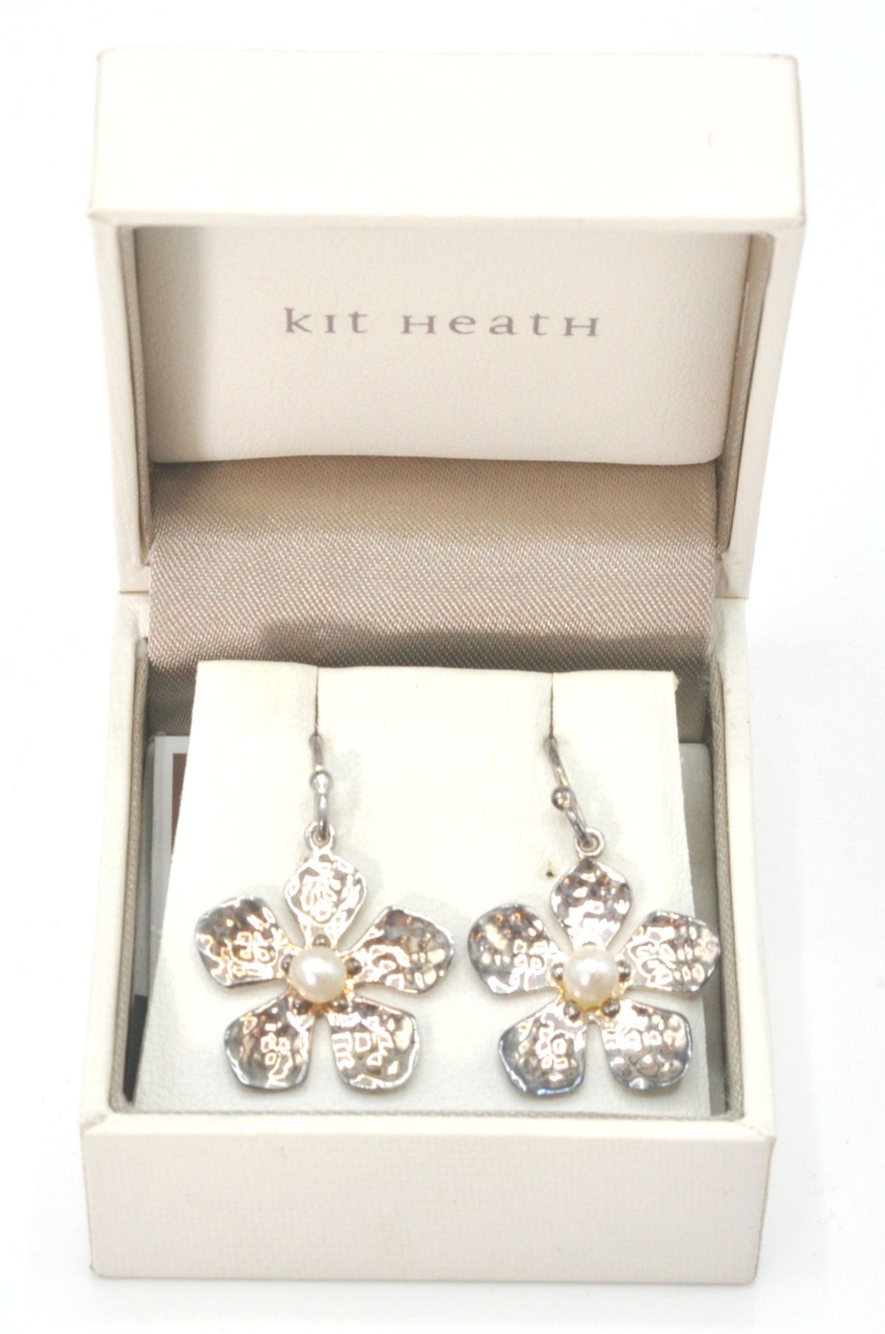 A pair of Kit Heath original modernist sterling silver earrings. The earrings with flower head