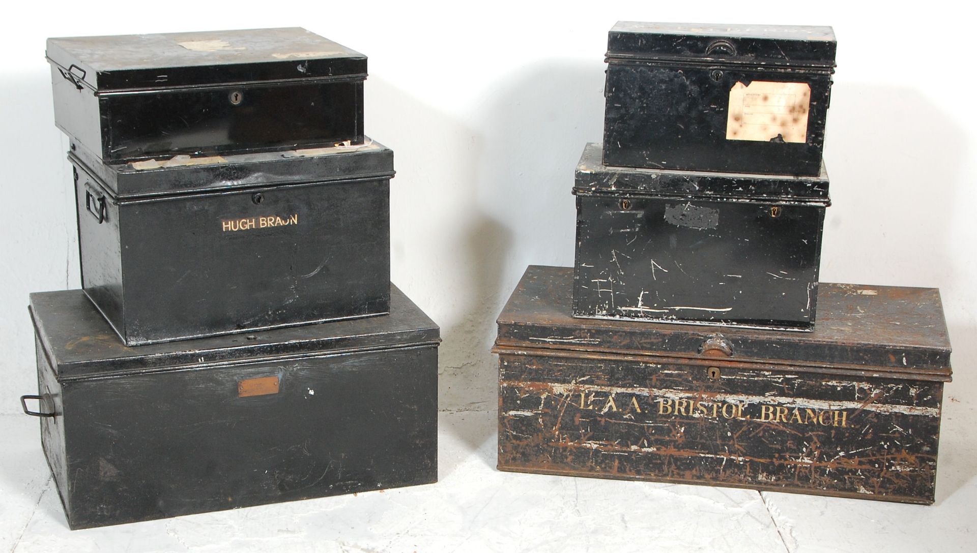 A good group of six metal deed storage boxes with being painted black with metal carrying handles