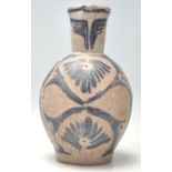 An antique handmade earthenware jug, possibly North American /  Navajo having incised abstracted