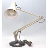 A vintage 20th Century Herbert Terry Anglepoise industrial desk lamp finished in army green enamel