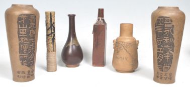 A collection of Chinese vases, all of stoneware construction to include a tall solifleur vase,
