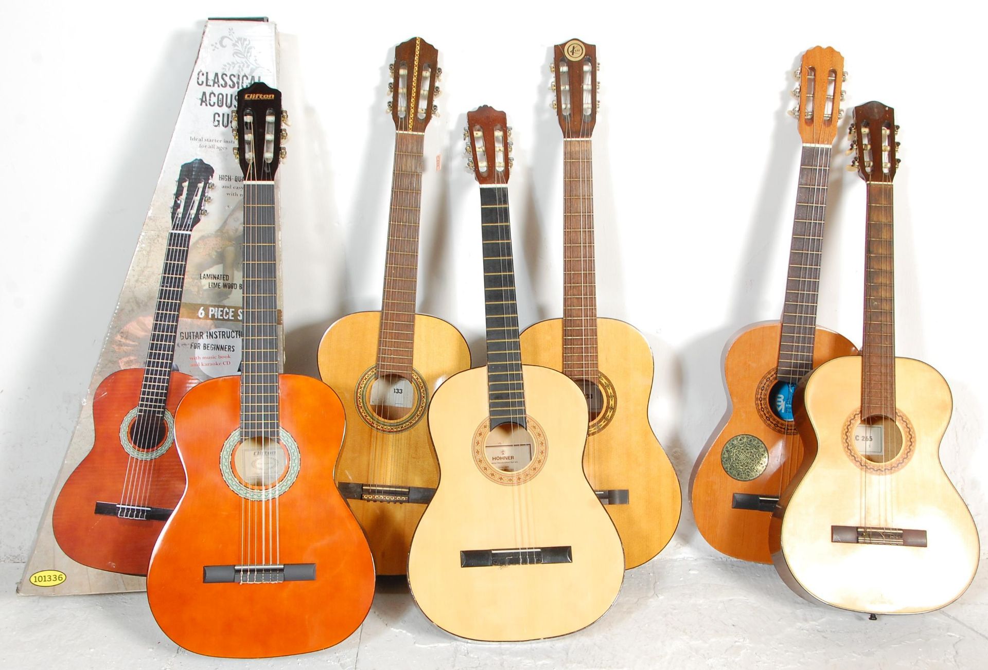 A group of six guitars. All guitars being acoustic six string examples to include BM Clasico Spanish